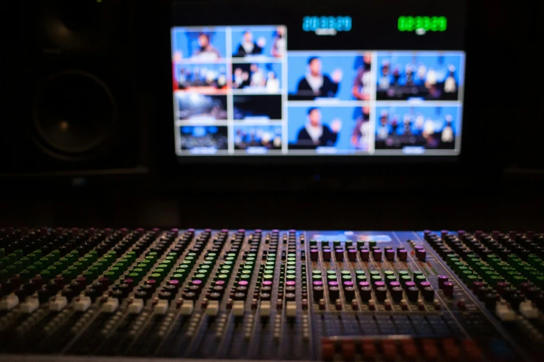 an mixing console with sound effects in front of a television