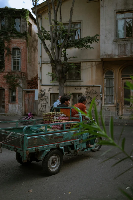 a truck with baskets full of fruit in front of a building