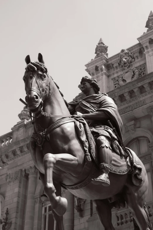 black and white po of statue of a man riding on a horse