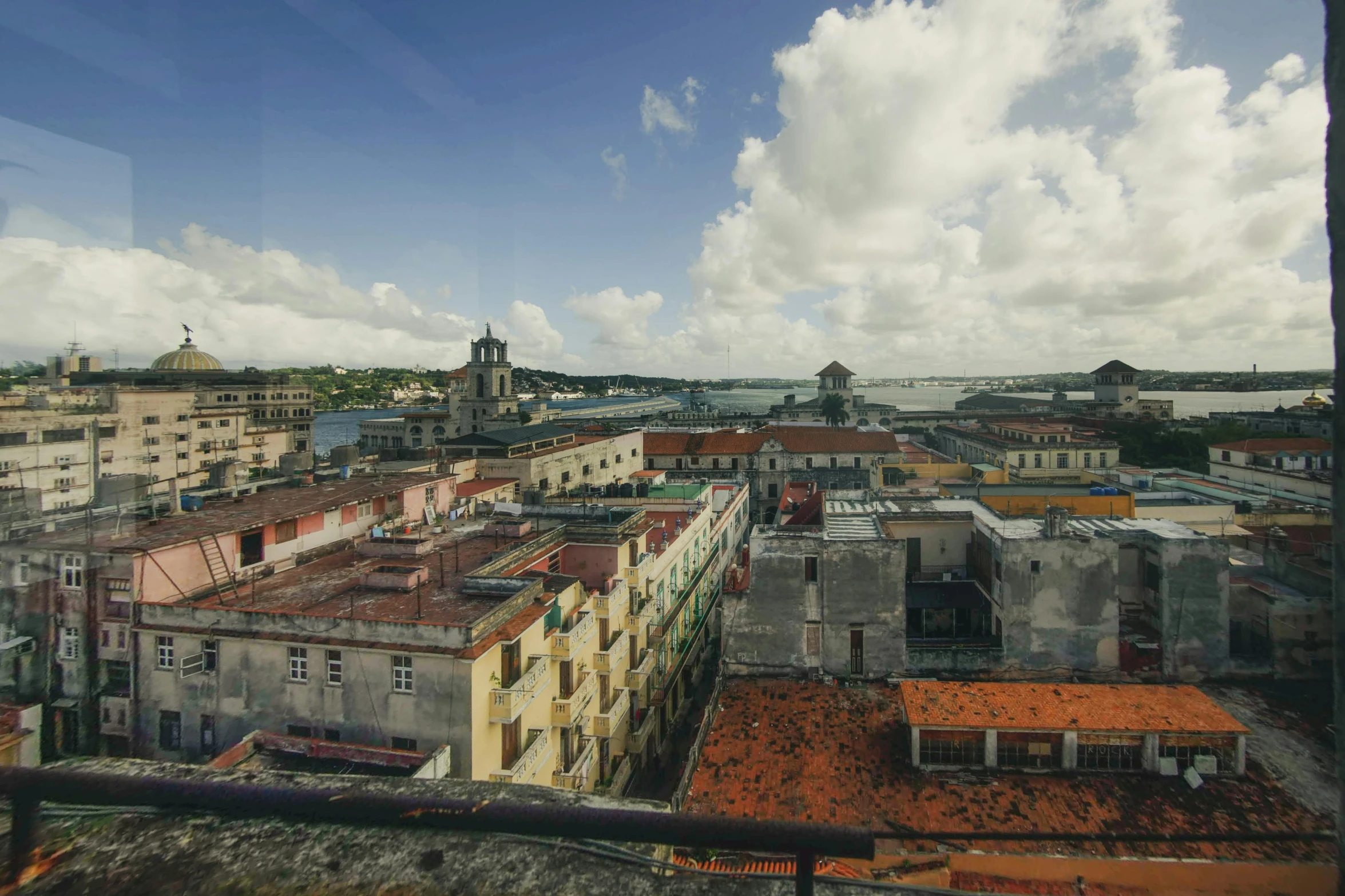 view from the city looking out at a bridge and buildings