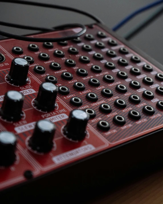 a red circuit board sits on a table