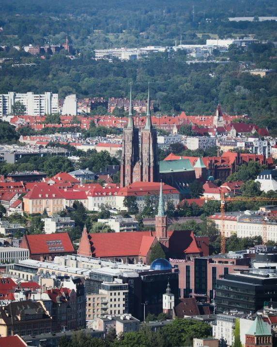 a very tall church tower towering over a city