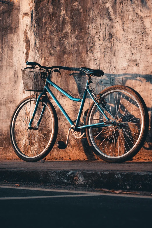 a bike parked on a ledge against a wall