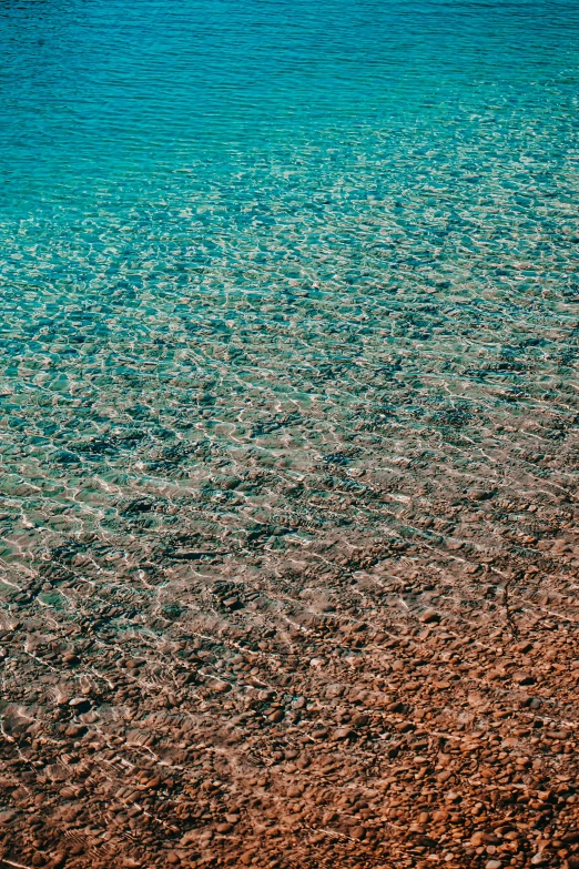 the water looks like it is reflecting off the shore