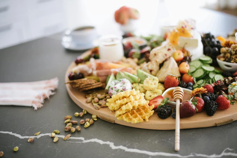 a very pretty plate of tasty food with fruits and nuts