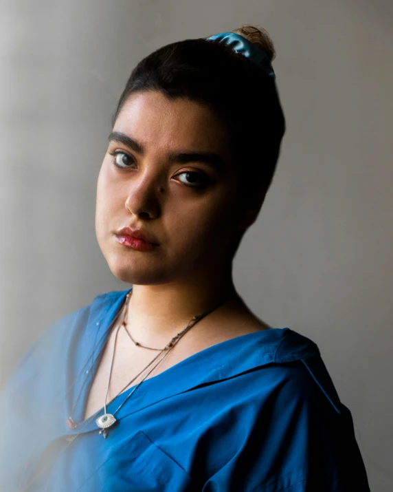 a woman with a hair bun on top of her head