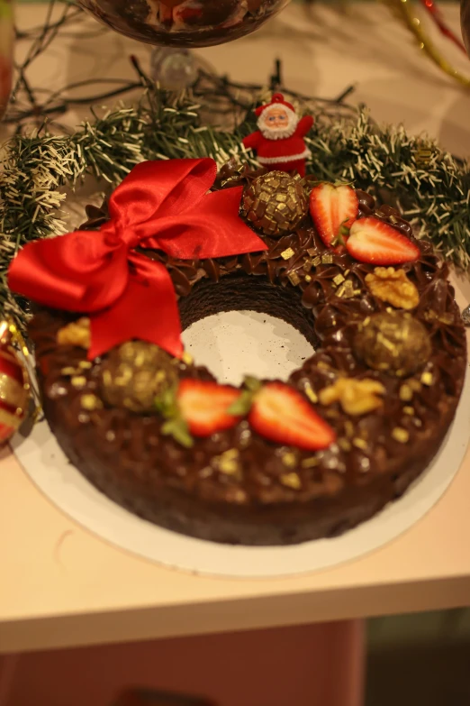 the chocolate cake has a wreath on top