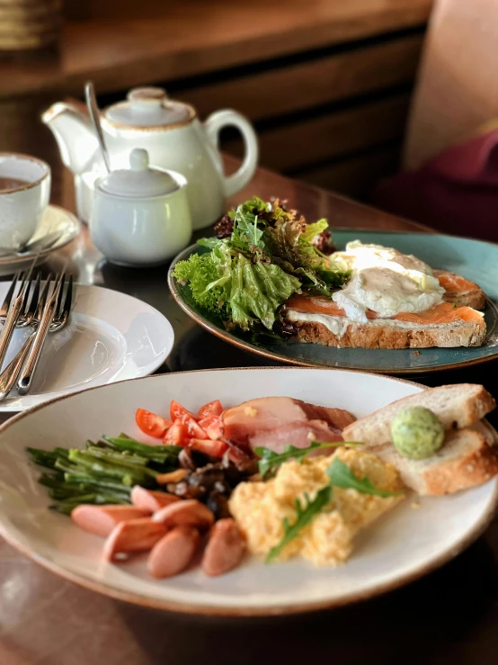 a variety of breakfast foods is displayed on a table