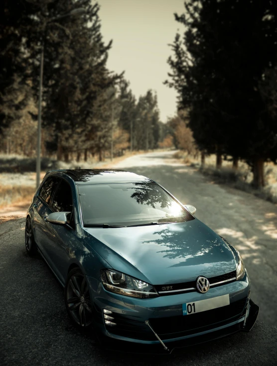 a volkswagen car parked on a road in a rural area