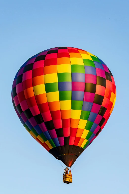 a very big pretty air balloon flying in the sky