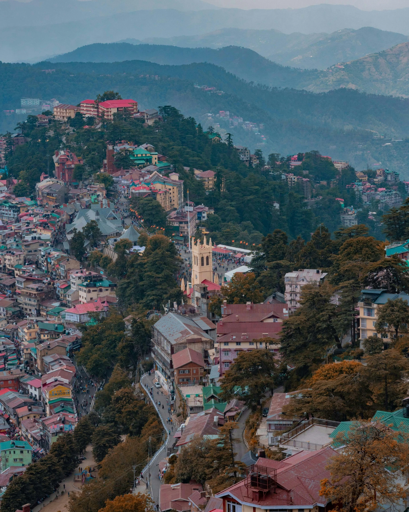 the city of bansurn is surrounded by mountains and trees