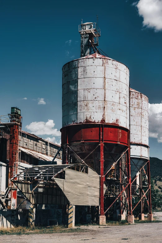 a big industrial building with very tall metal structures