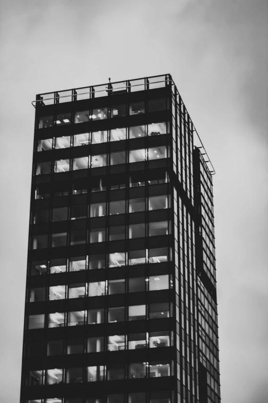 a very tall building with lots of windows in front of it