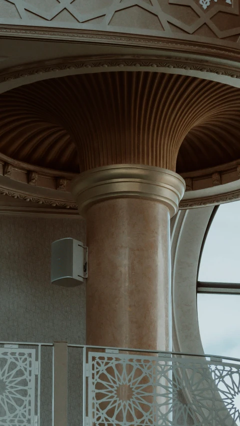 a balcony with circular walls and wood floors