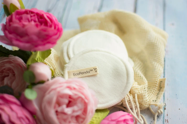 a close up of flowers and cloth on a table