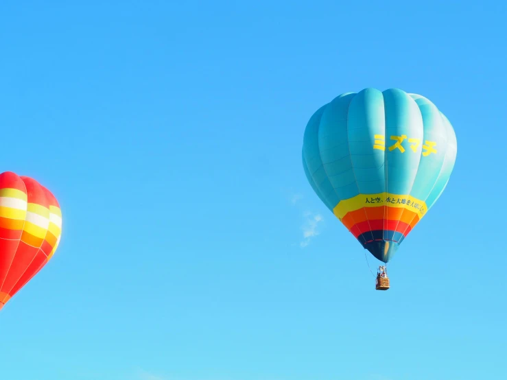 two  air balloons are in the air