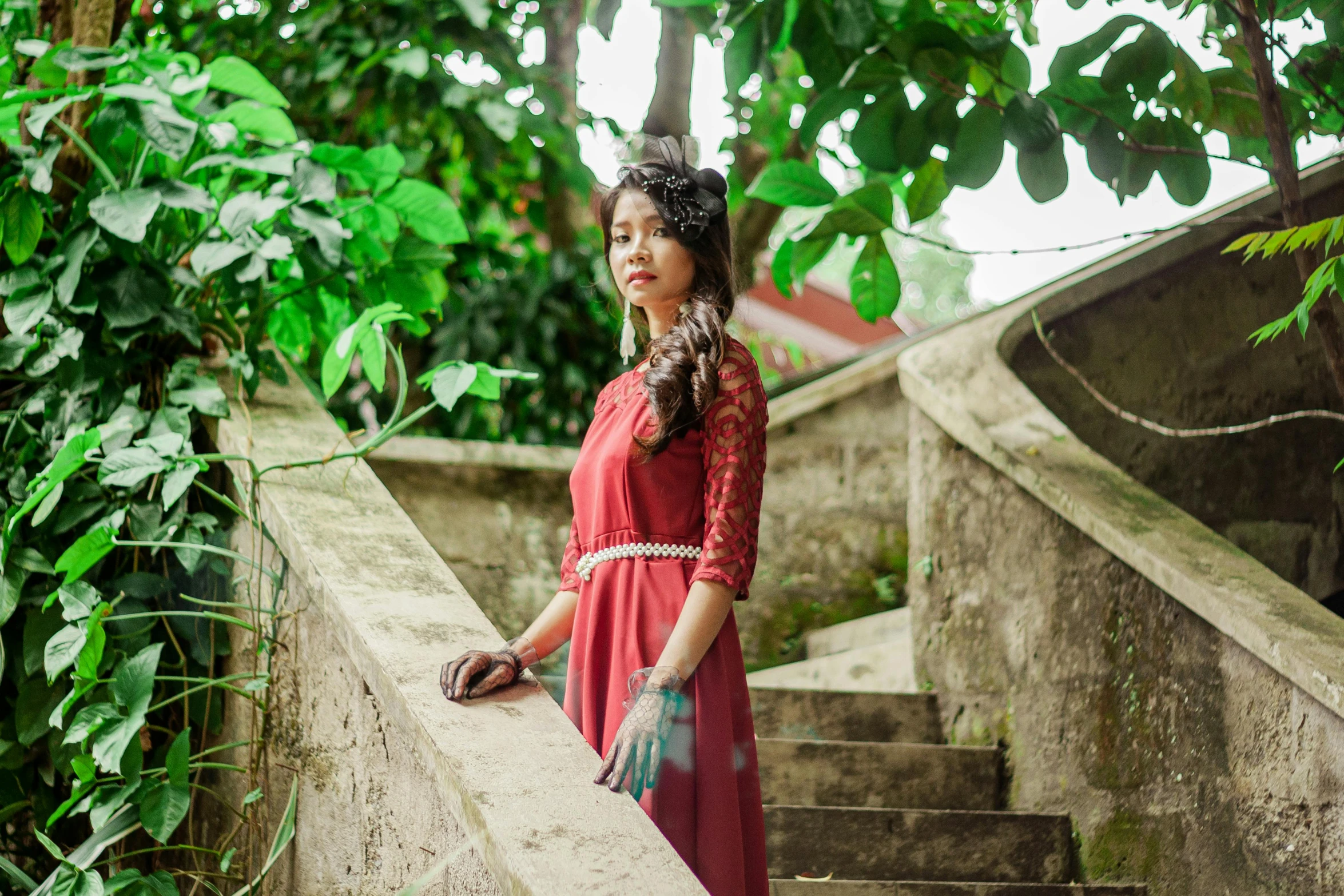 a woman posing for a po on the stairs