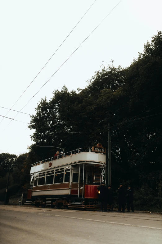 a small bus sitting on the side of the road