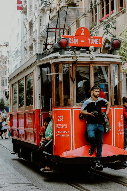 an electric trolley driving down a busy street