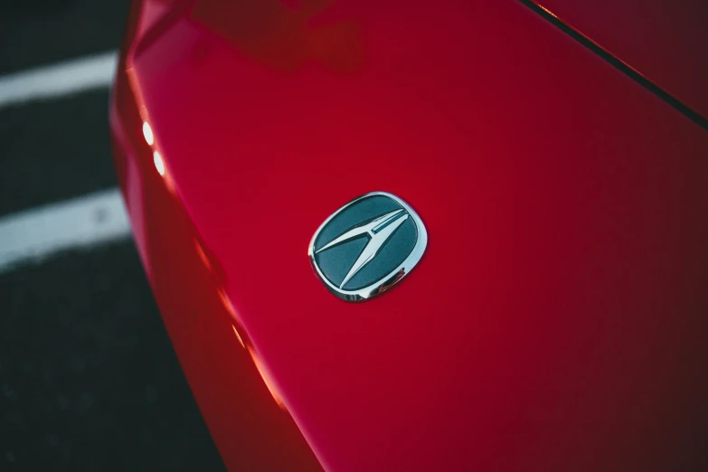 the emblem on a red car is shown