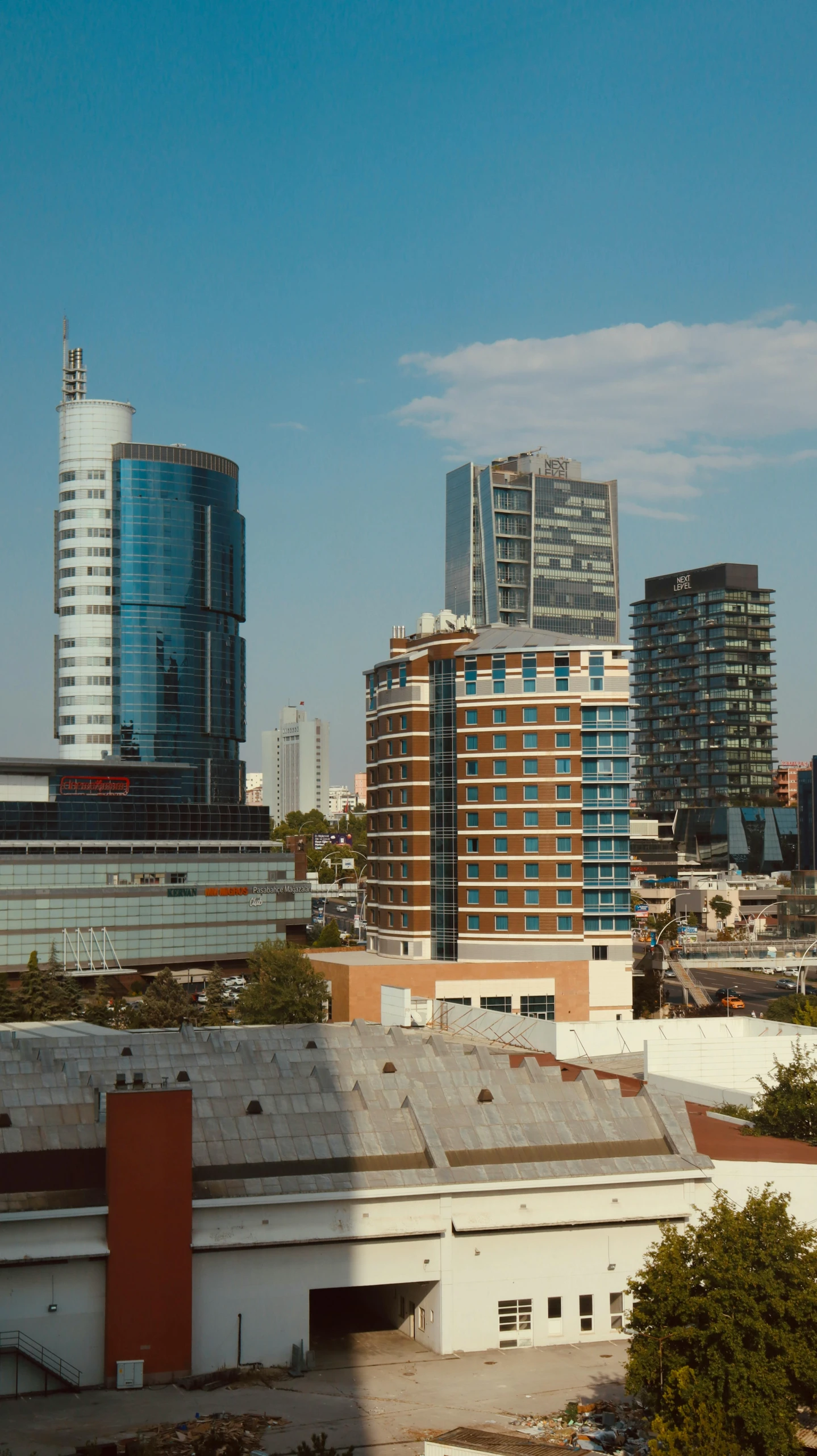 some buildings are seen in the background with trees