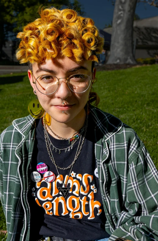 a young lady with long hair wearing glasses