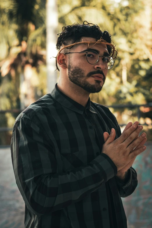 a man with some sort of head covering and black shirt