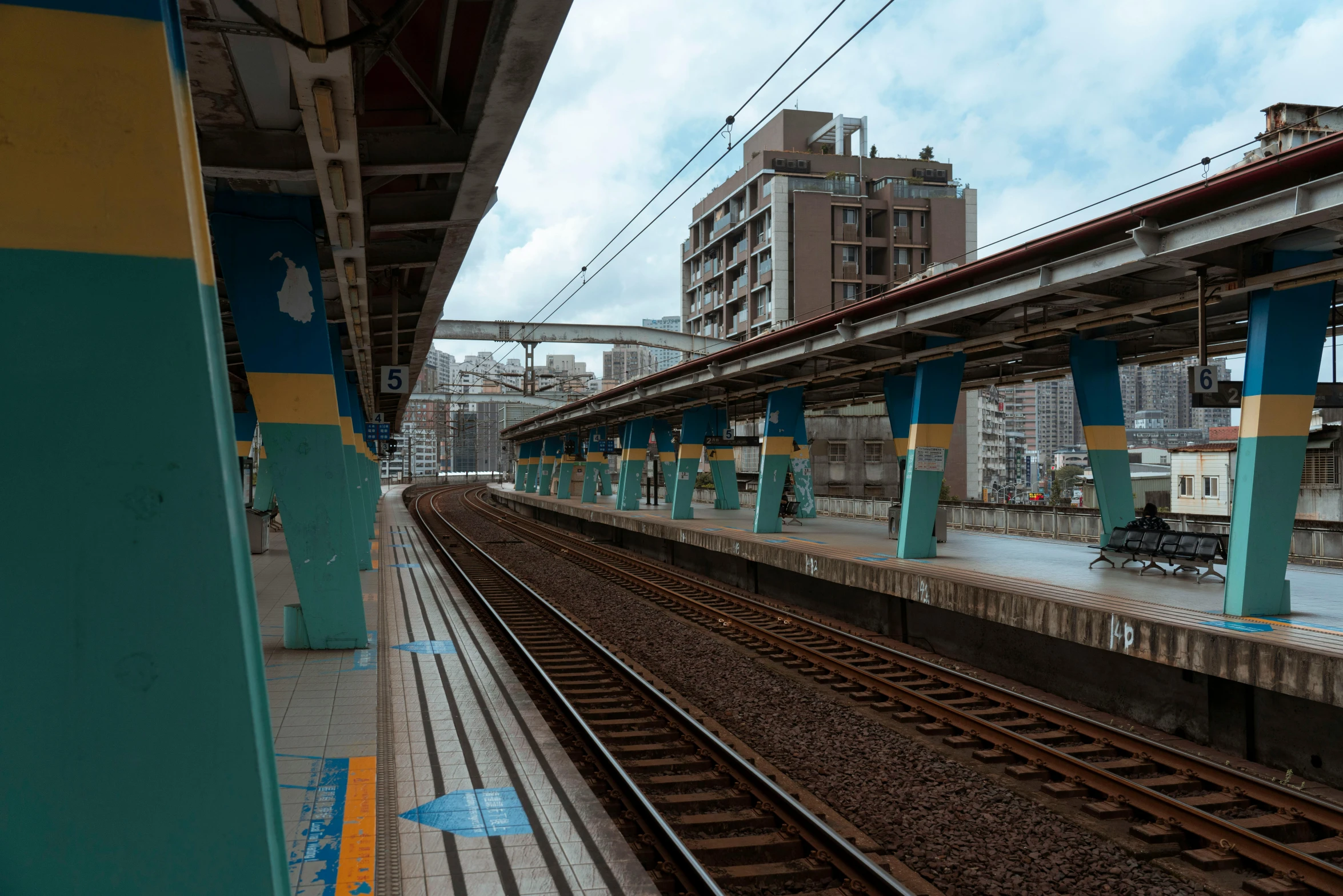 train tracks in the middle of an urban area