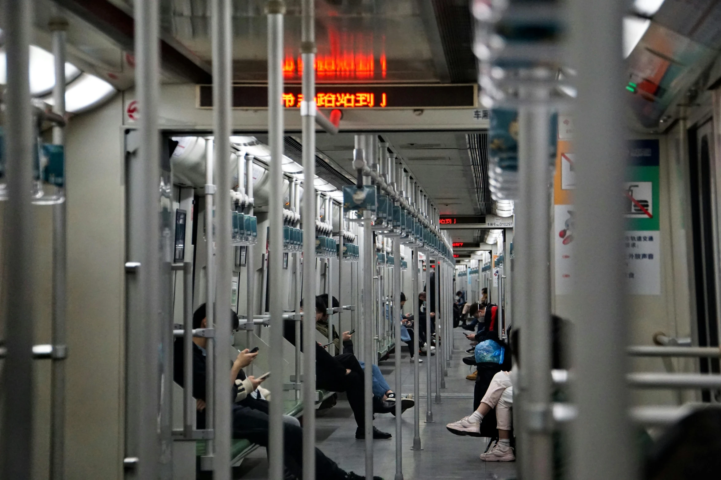 people sitting on the inside of a train