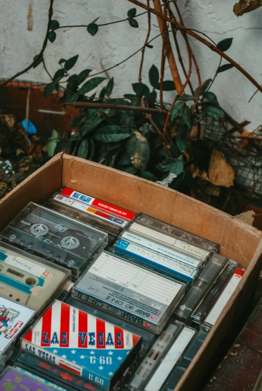 a crate filled with lots of old time audio tapes