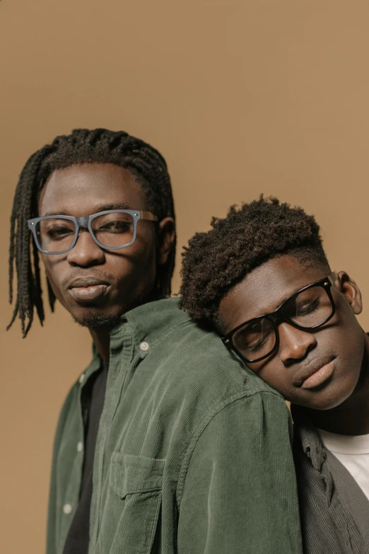 two young men with glasses and dread locks