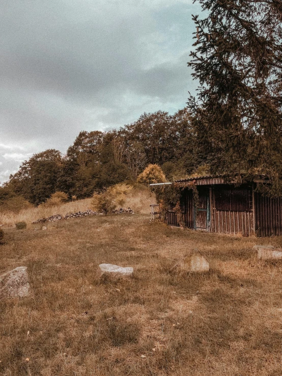 a wooden structure sitting on top of a field