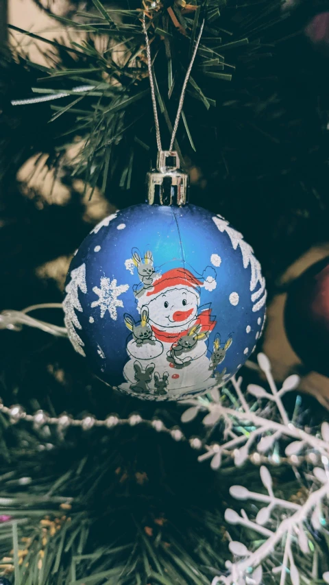 the decoration on a christmas tree has been decorated with snowmen