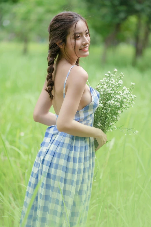  with id in grass holding flowers