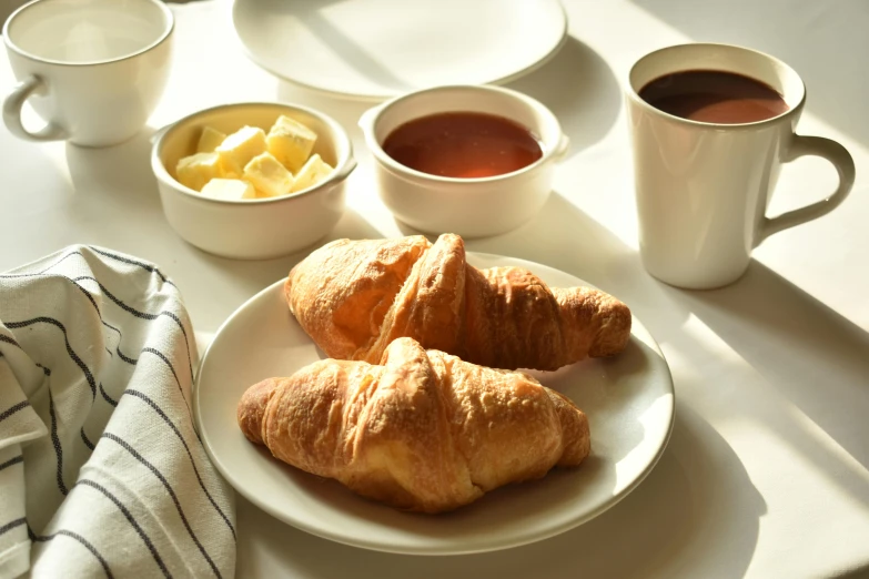 an assortment of breakfast foods sitting on a table