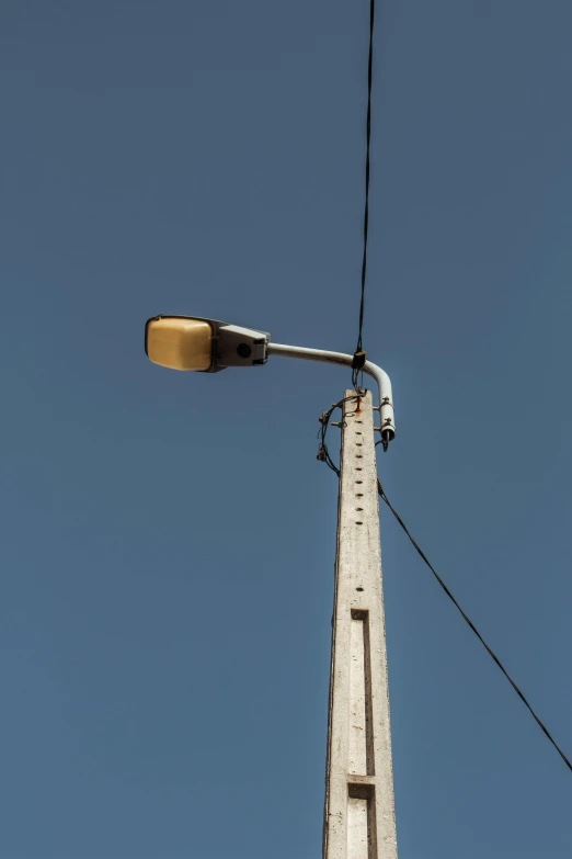 a streetlight attached to the side of a building