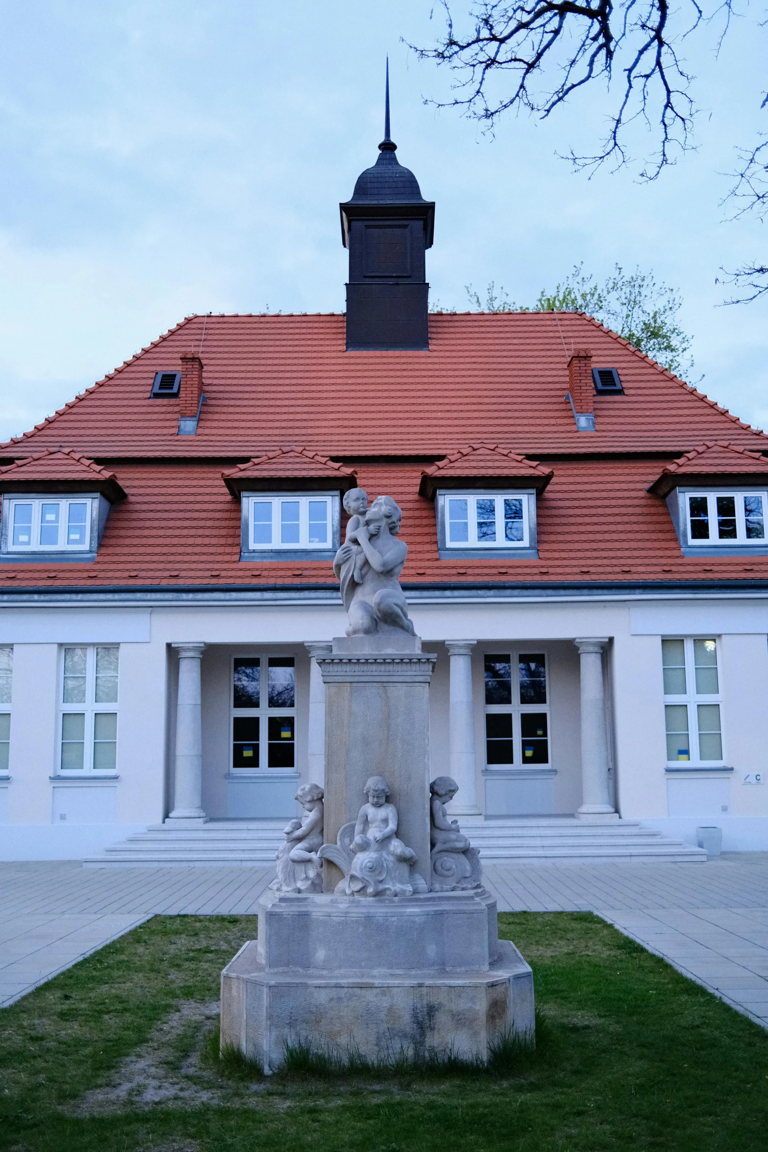 a picture of a small house with an intricate statue