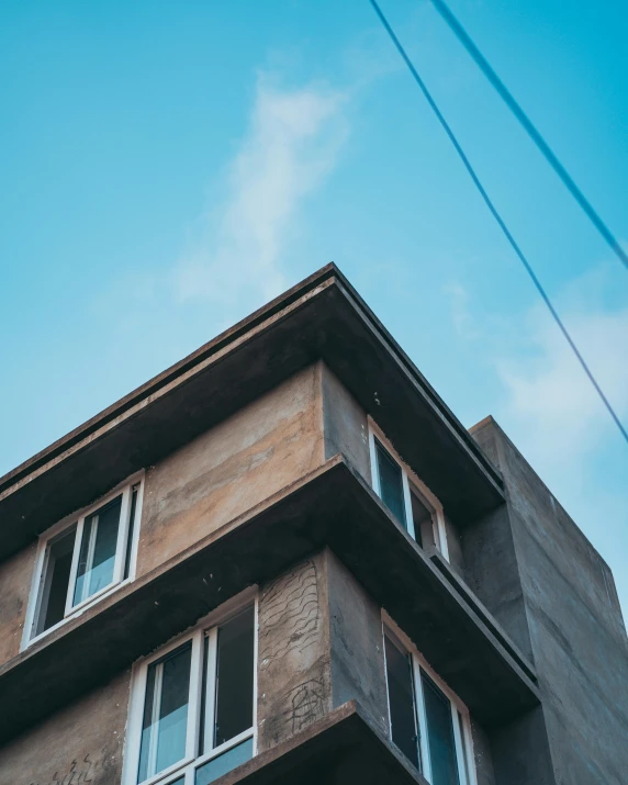 a very tall building with windows and no tops