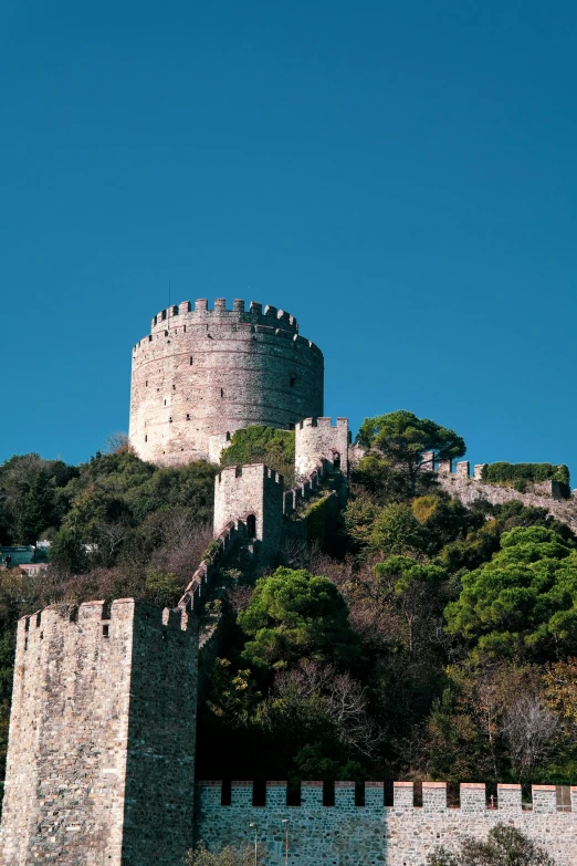 the castle is perched high up on the hill