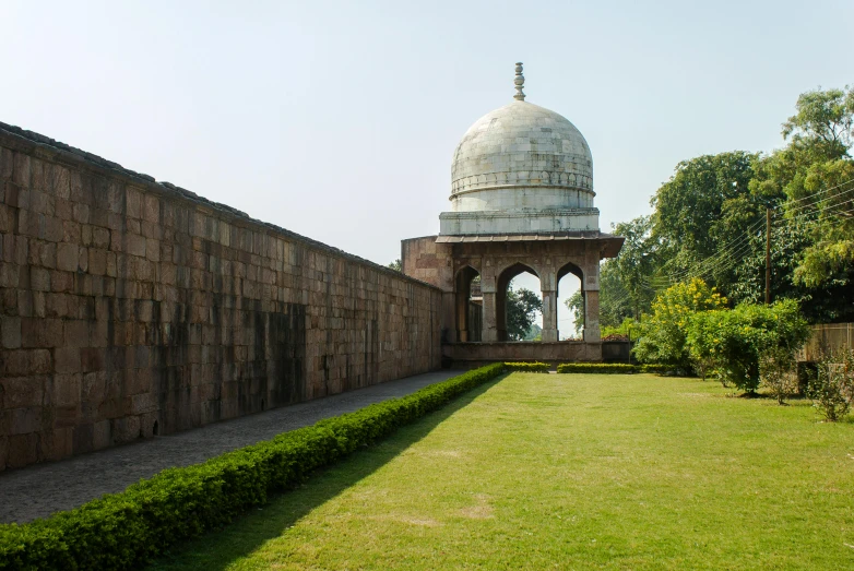 a building sits at the end of a brick walkway