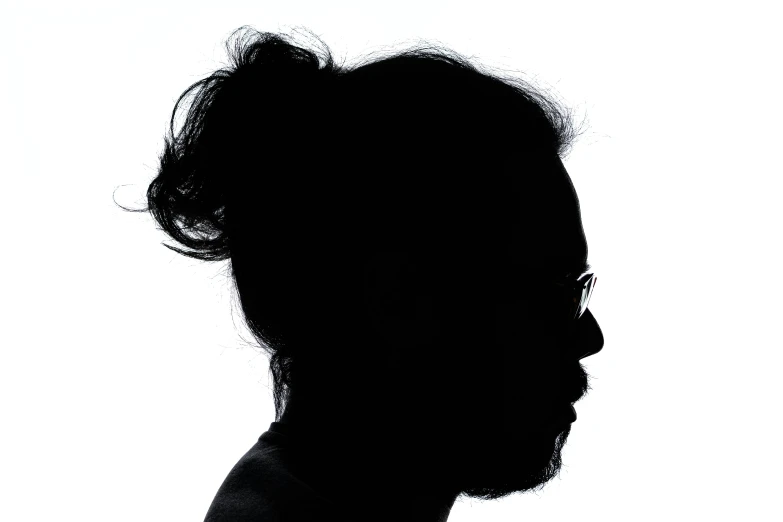 silhouette of a man with his chin raised