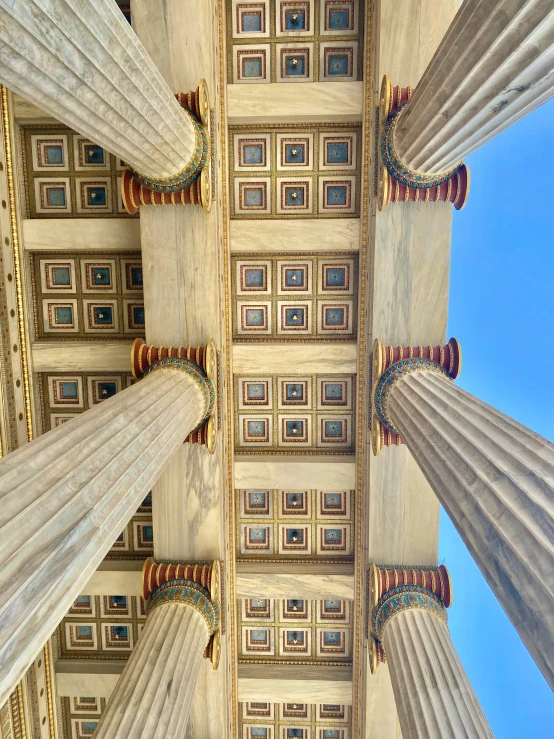 the interior of a building with very elaborate columns