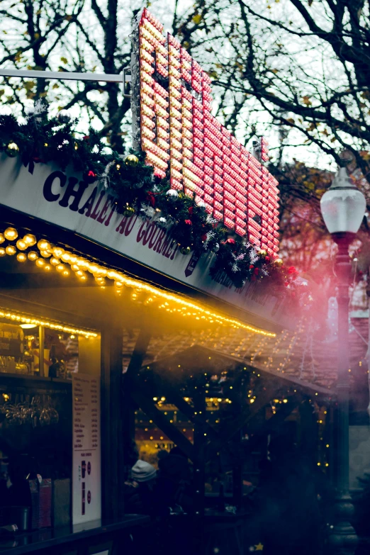 the outside of a restaurant with a neon sign