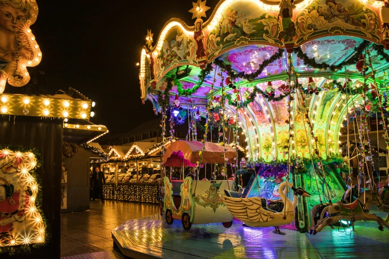 a merry go round at night with lots of lights