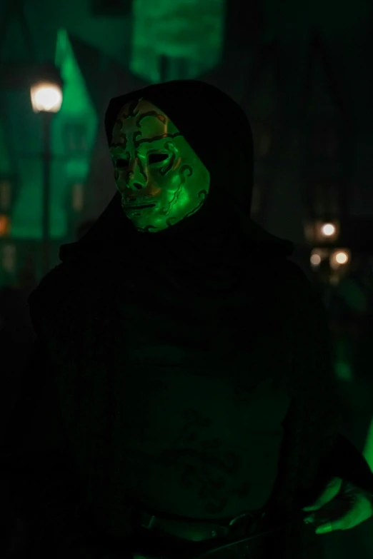 a man with a green light painted on his face