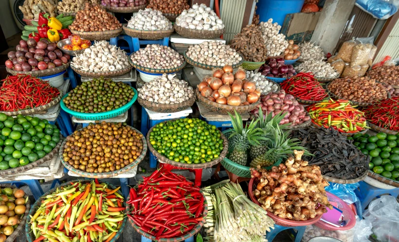 many fruits and vegetables sitting in plastic containers