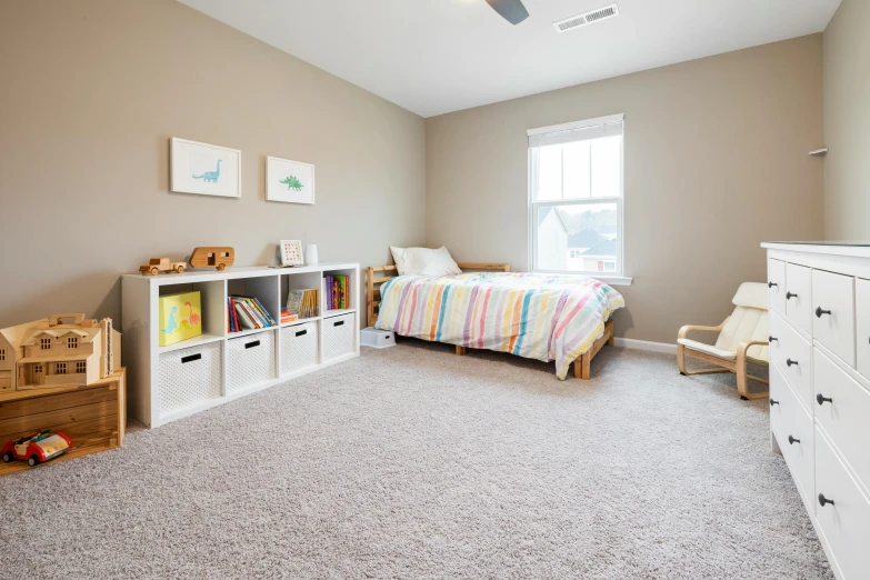 the room has many toys in it, including a book shelf