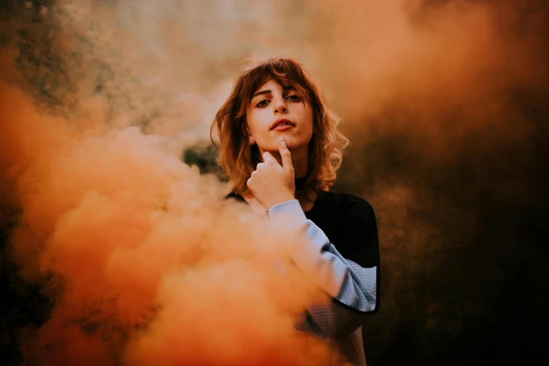 a person standing with a cigarette near them