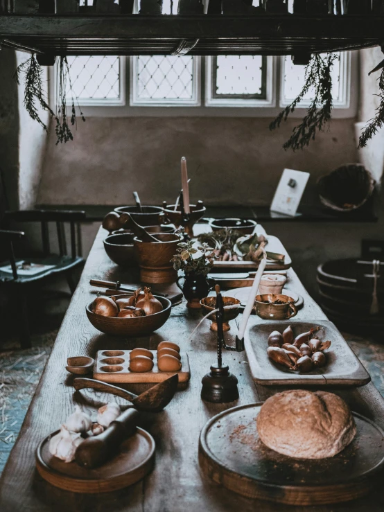 food is served on a table in front of two windows