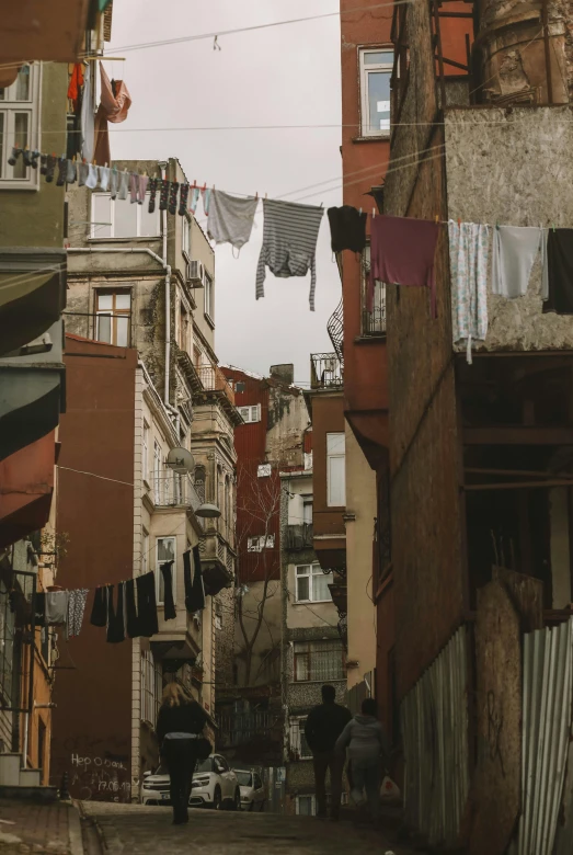 laundry hangs on the clothes line and some buildings